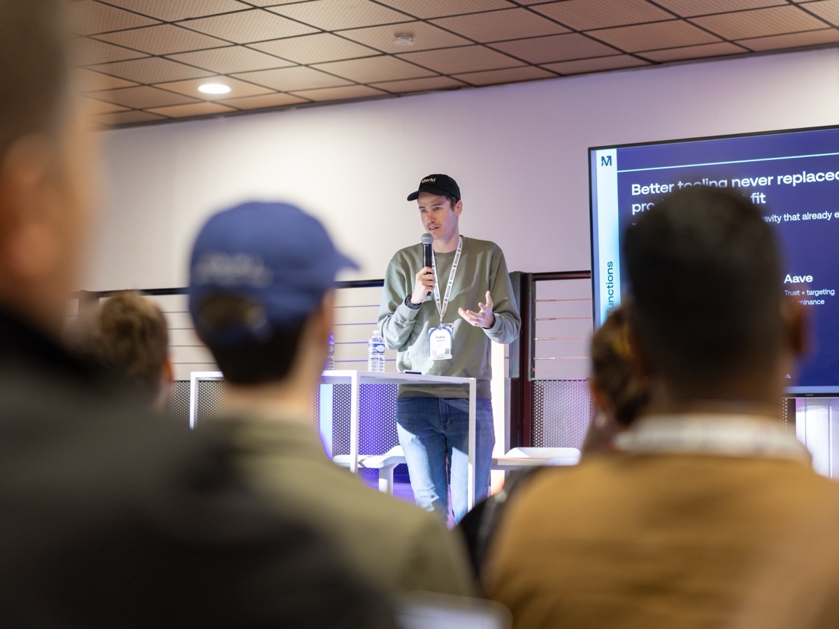 A member of the Merkl team presenting Merkl on stage to an audience at a conference